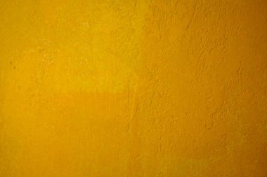 Bright grunge wall texture. Grunge vintage stone wall background texture with yellow husks texture. Vintage yellow wall wallpaper. Texture wall, yellow grunge background.