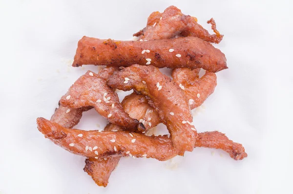 Cerdo frito con semillas de sésamo blanco — Foto de Stock