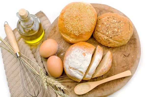 Fresh bread and wheat on the wooden — Stock Photo, Image