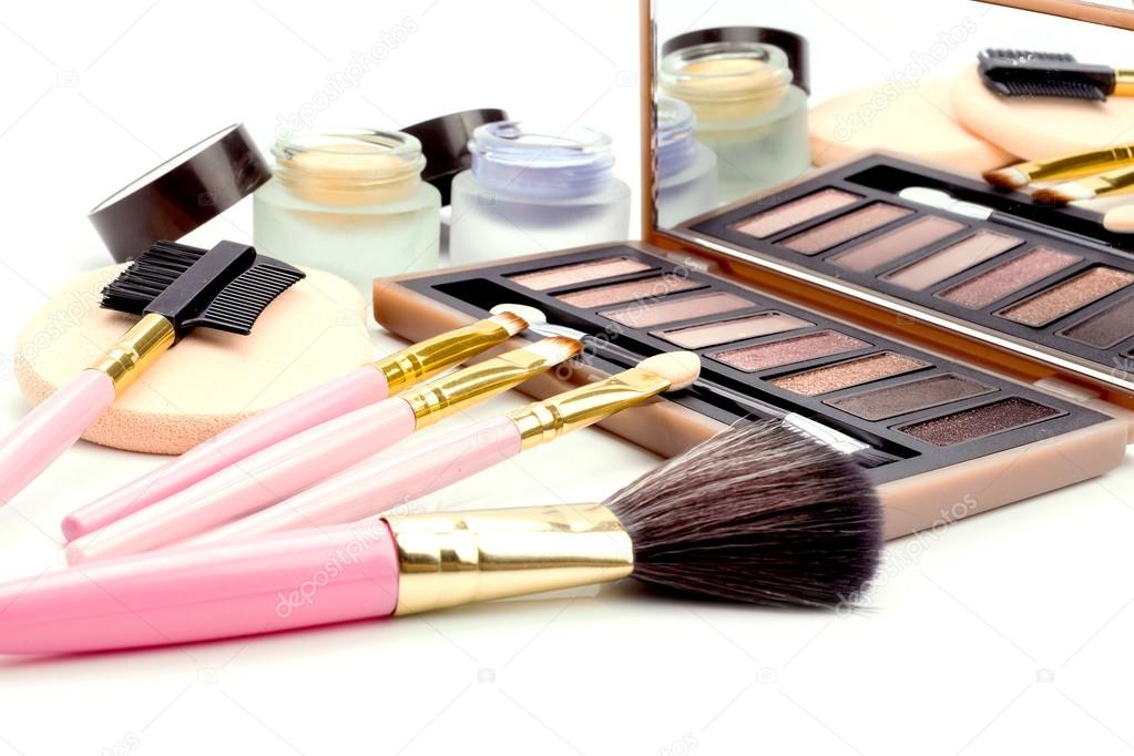 make-up brushes in holder and cosmetics 