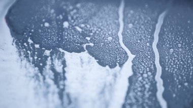 Araba yıkarken sabun köpüğünün soyut arkaplanı, makro, yakın plan.