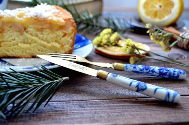 Apple pie with vintage knife and fork painted  blue flowers