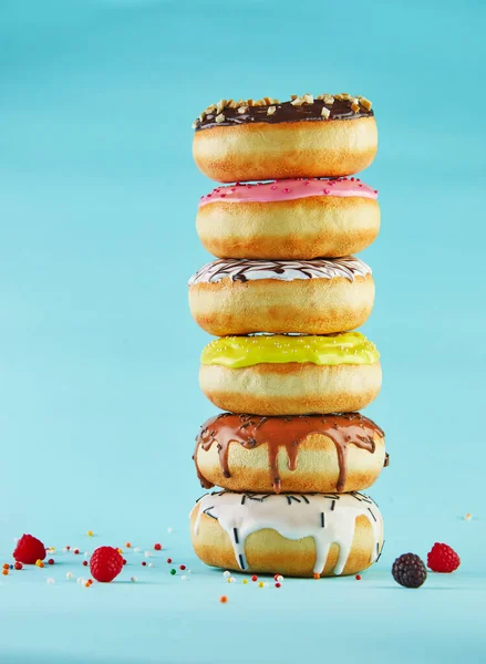 Multicolored Donuts Icing Sprinkling Stacked Stack Blue Background — Stock Photo, Image