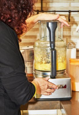 Kneads pancake dough in an electric blender. Step by step recipe.