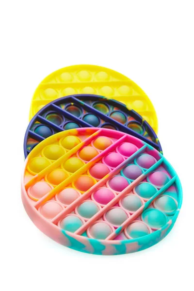 Juguete colorido del anti-estrés sensorial de la burbuja del estallido del empuje, aislado en fondo blanco. — Foto de Stock