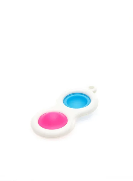 Juguetes coloridos del anti-estrés sensorial de la burbuja del estallido del empuje, aislados en fondo blanco — Foto de Stock