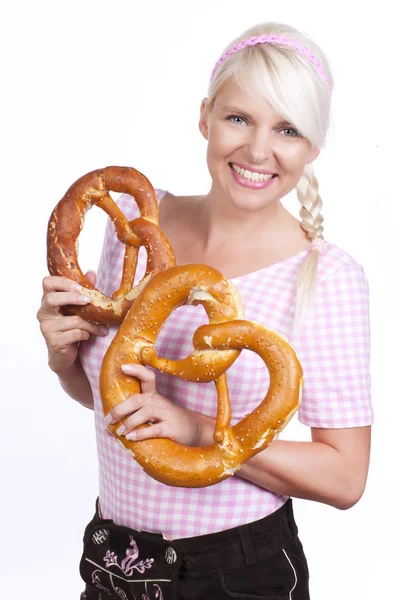 Blonde woman with beer and pretzel — Stock Photo, Image