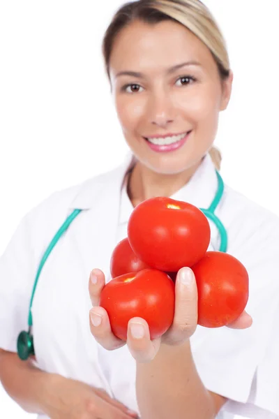 Médico feminino aconselha tomates — Fotografia de Stock