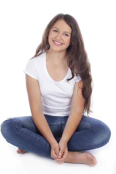 Teenage girl sitting on the floor — Stock Photo, Image