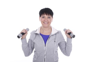 Happy elderly woman with dump bells