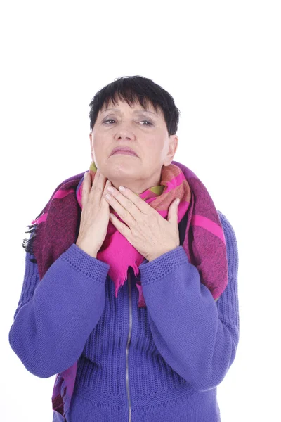 Elderly woman touches her throat — Stok fotoğraf