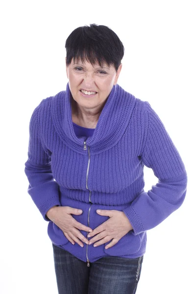 Elderly woman with stomach pain — Stockfoto