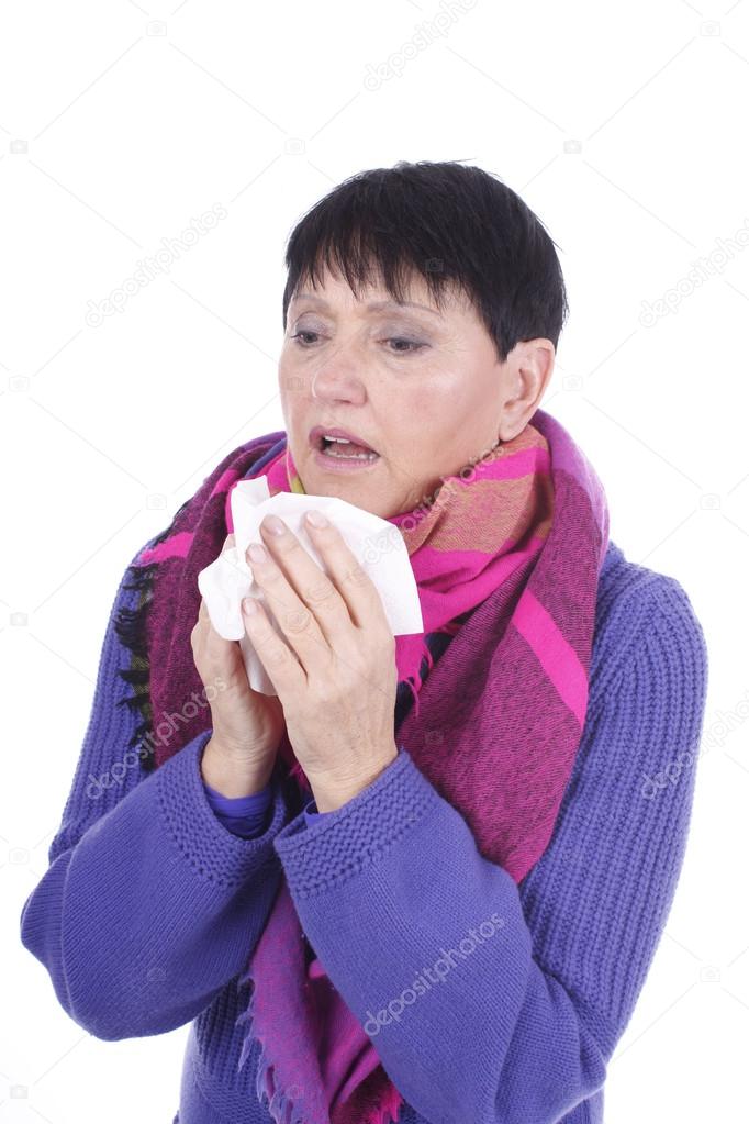 Elder woman with handkerchief and cold