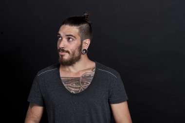 Young man with pony tail and tattoos clipart