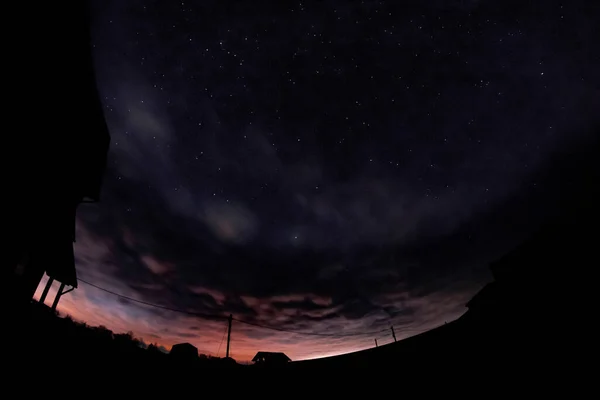 Luz desvanecendo no céu noturno — Fotografia de Stock