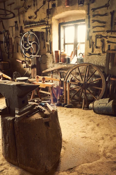 Anvil against the window — Stock Photo, Image