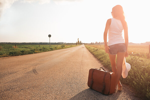 Traveler girl with suitcase