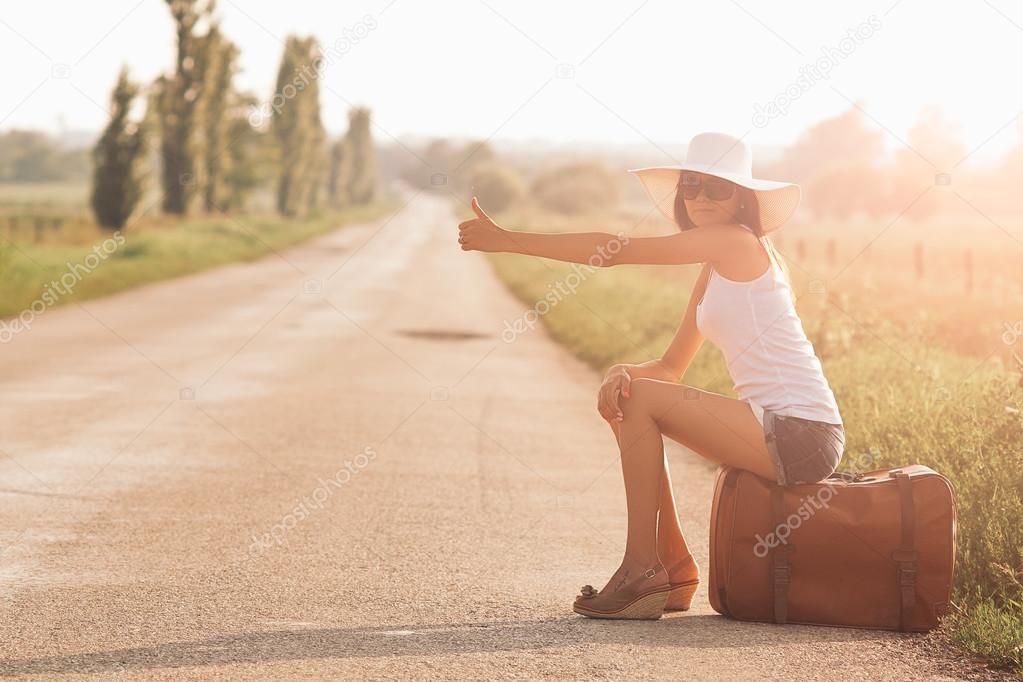 Traveler girl with suitcase