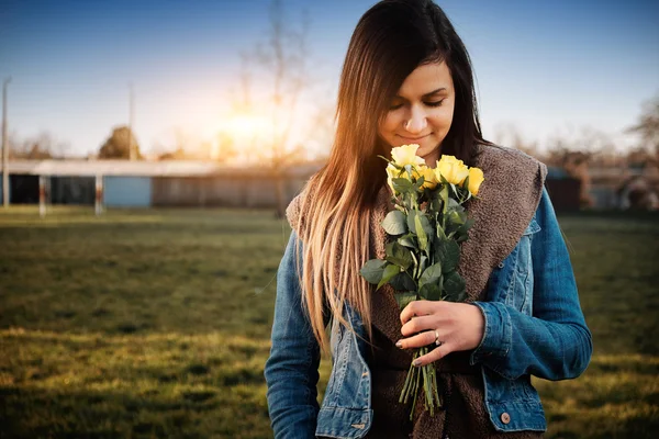 Woman with yellow rose — Stock Photo, Image