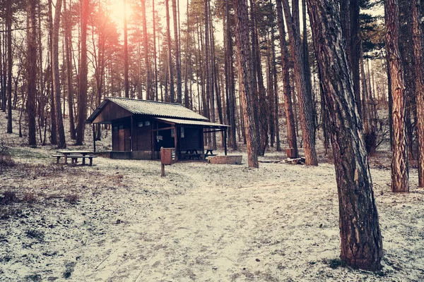 Woodhouse in winter forest — Stock Photo, Image