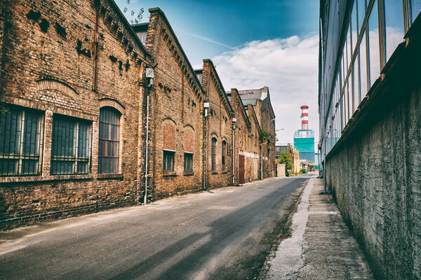 Abandoned industrial buildings on old factory at bright, sunny day