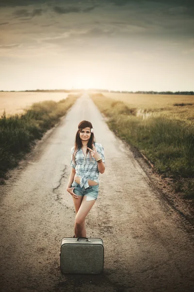 Traveler hippie girl with suitcase — Stock Photo, Image