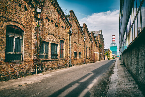 Abandoned industrial buildings on old factory at bright, sunny day