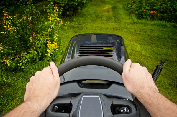 Man driving a mower tractor - point of view — Stock Photo, Image