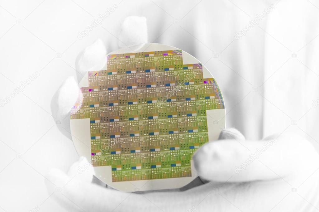 Engineer holding silicon wafer