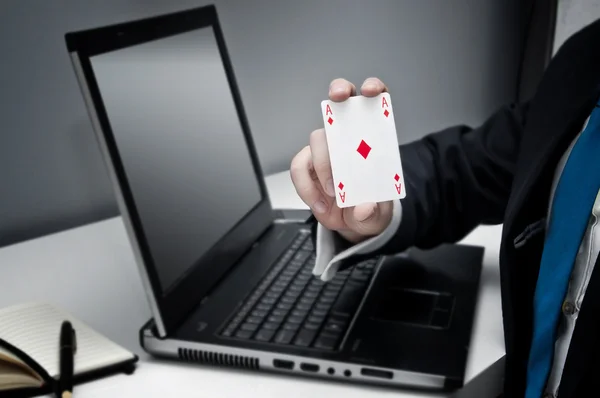 Businessman holding ace of diamonds playing card — Stock Photo, Image