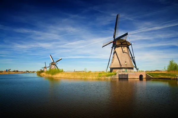 Windmills at riverside on a sunny day, Netherlands — Stock Photo, Image