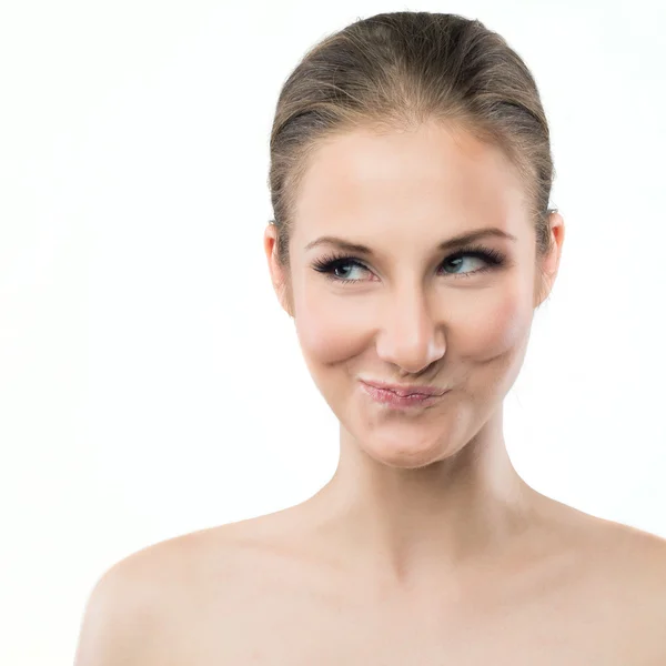 Retrato de una mujer joven haciendo expresión de la cara divertida —  Fotos de Stock