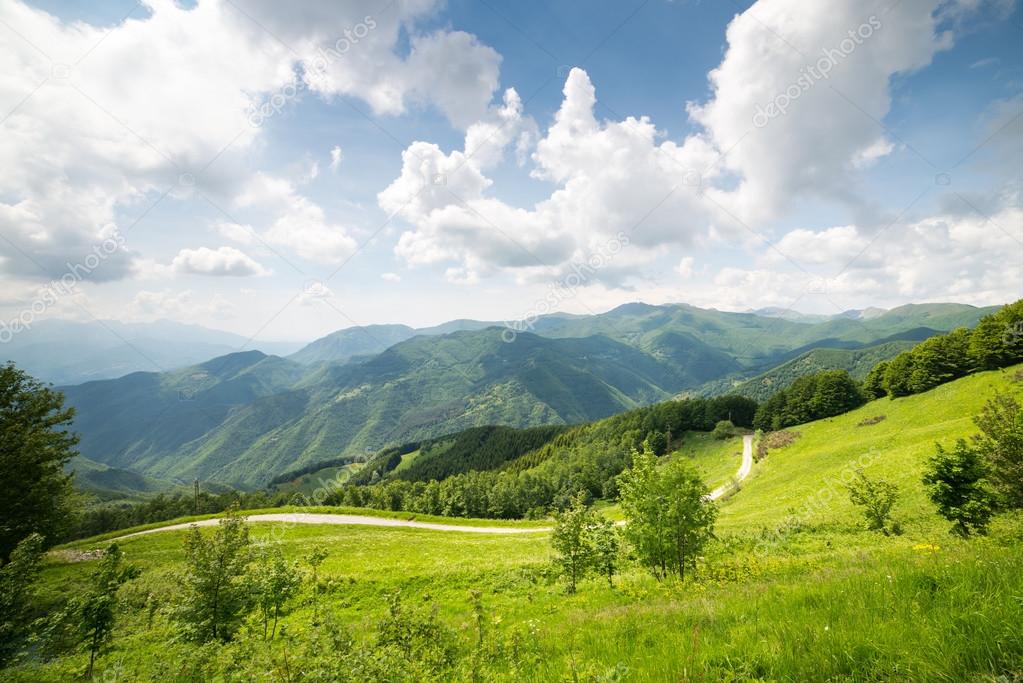 Mountains landscape against blue sky with clouds