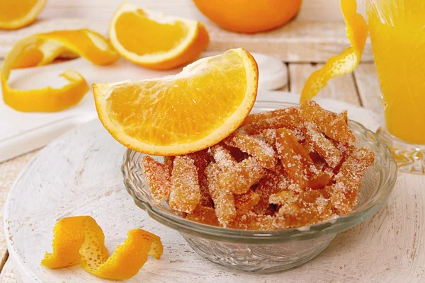 Homemade candied orange peels in glass bowl