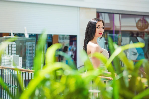 Pretty sexy woman with long hair through grass — Stock Photo, Image