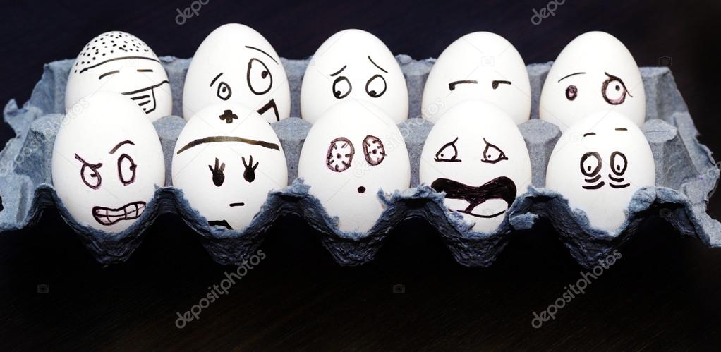 Funny emotional eggs crying and laughing in box