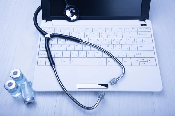 Medical devices on the table at the doctor with blue toned — Stock Photo, Image