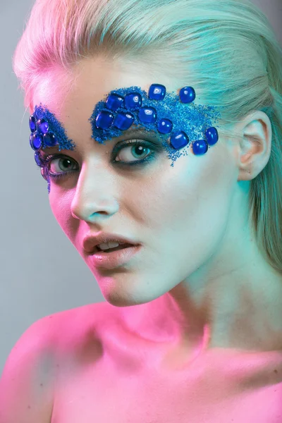 Girls blonde girl with creative make-up with stones with colore — Stock Photo, Image