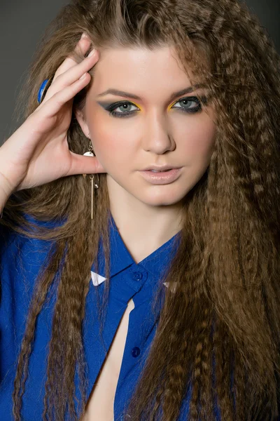 Girl with stylish make-up in a blue shirt — Stock Photo, Image