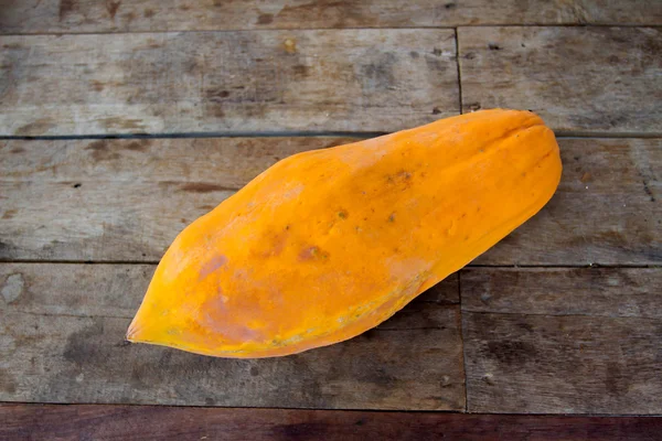 Papaya on wooden background — Stock Photo, Image