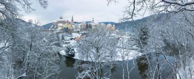 Royalty-free stock photo ID: 1910053222Stunning scenic view of beautiful cityscape of medieval Loket nad Ohri town with Loket Castle gothic style on massive rock, colorful buildings during winter season, Karlovy Vary Region, Czech Republic