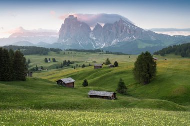 Superb morning scene of Compaccio village, Seiser Alm or Alpe di Siusi location, Bolzano province, South Tyrol, Italy, Europe. Colorful summer sunrise of Dolomiti Alps. Traveling concept.