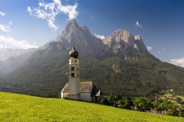 Superb morning scene of Compaccio village, Seiser Alm or Alpe di Siusi location, Bolzano province, South Tyrol, Italy, Europe. Colorful summer sunrise of Dolomiti Alps. Traveling concept.