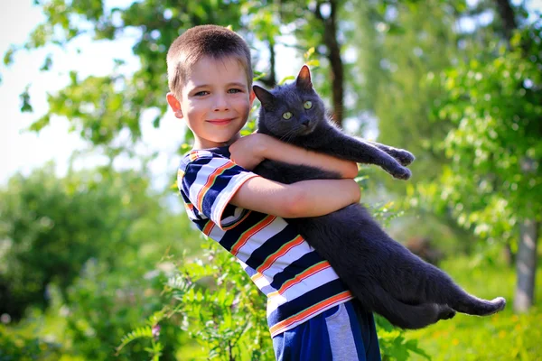 Menino e gato de estimação Imagem De Stock