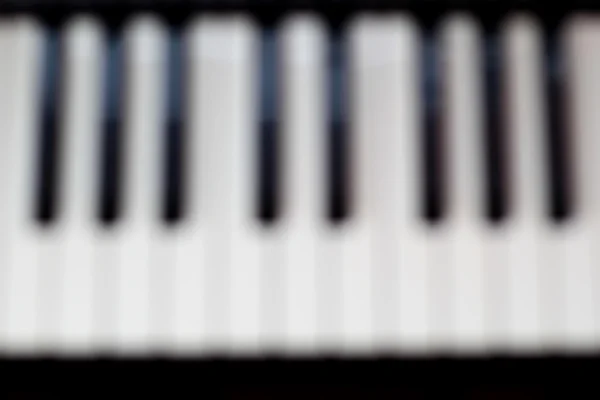 Pianoforte sfondo con tasti sfocati — Foto Stock