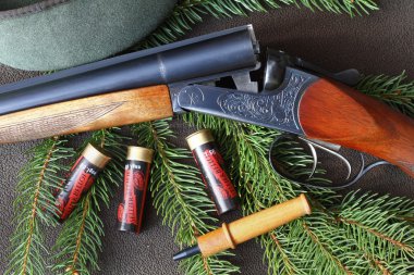 Hunting still life with shotgun clipart