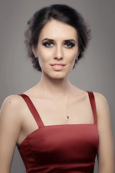 Beautiful Woman in Red Elegant Dress Wearing Ruby Jewelry — Stock Photo, Image