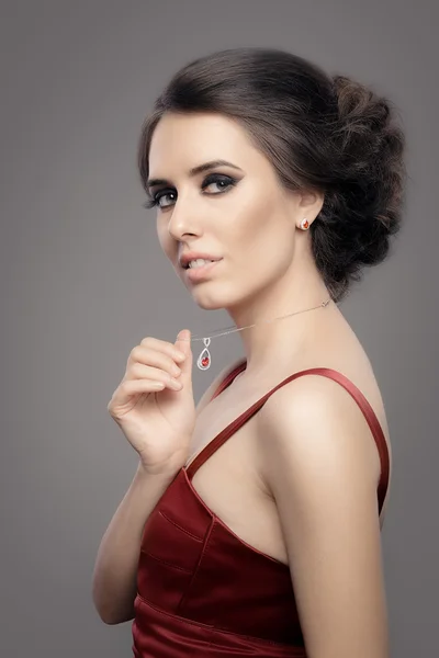 Beautiful Woman in Red Elegant Dress Wearing Ruby Jewelry — Stock Photo, Image