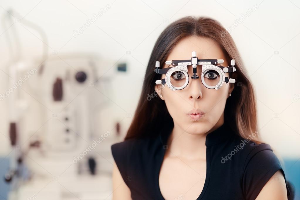 Funny Girl at Ophthalmological Exam Wearing Eye Test Glasses 