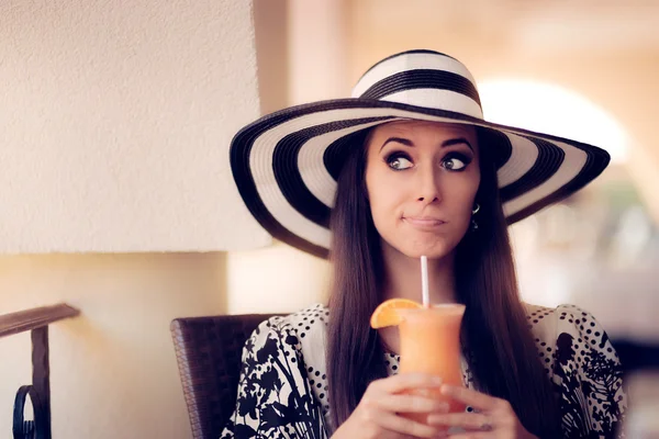 Surprised Woman With Orange Juice in a Restaurant — Stock Photo, Image